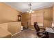 Functional office space featuring a desk, comfortable chair, and natural light, perfect for a home office at 1350 S Greenfield Rd # 2205, Mesa, AZ 85206