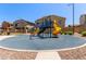 Community playground features a colorful jungle gym on a safe, cushioned surface at 1350 S Greenfield Rd # 2205, Mesa, AZ 85206
