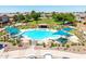 Beautiful community pool with shaded pergolas and lounge chairs, perfect for hot summer days at 1350 S Greenfield Rd # 2205, Mesa, AZ 85206