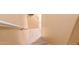Beige carpeted staircase leading to the entry door, with neutral walls and a white handrail at 1350 S Greenfield Rd # 2205, Mesa, AZ 85206