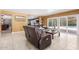 Comfortable living room with plush seating, neutral tile flooring, and natural light at 1417 W Rose Ln, Phoenix, AZ 85013
