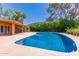 Inviting swimming pool with a spacious patio, perfect for outdoor relaxation and entertainment at 1417 W Rose Ln, Phoenix, AZ 85013