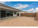Spacious backyard offering a covered patio, ample room for entertaining, and a blank canvas for landscaping at 14177 W Calle Lejos --, Surprise, AZ 85387