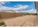 Large backyard featuring block wall fencing with potential for custom landscaping and outdoor living at 14177 W Calle Lejos --, Surprise, AZ 85387