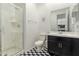 Stylish bathroom with a glass-enclosed shower, patterned tile flooring, and sleek vanity, creating a modern and inviting space at 14177 W Calle Lejos --, Surprise, AZ 85387