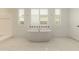 Luxurious bathroom featuring a standalone soaking tub, white marble floors, and stylish tile accents for a spa-like experience at 14177 W Calle Lejos --, Surprise, AZ 85387