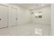 A sunny bedroom features tile floors and bright natural lighting at 14177 W Calle Lejos --, Surprise, AZ 85387