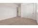 Spacious bedroom has neutral carpet and a closet with white sliding doors at 14177 W Calle Lejos --, Surprise, AZ 85387