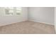 This bedroom offers comfortable neutral carpeting and a window for natural light at 14177 W Calle Lejos --, Surprise, AZ 85387