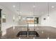 Kitchen island featuring a granite countertop, stainless steel sinks, and modern hanging lighting fixtures at 14177 W Calle Lejos --, Surprise, AZ 85387