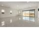 Large and bright living area with sleek porcelain tile, recessed lighting, and large windows at 14177 W Calle Lejos --, Surprise, AZ 85387