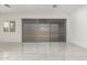 Spacious living area with porcelain tile flooring, and natural light streaming through window at 14177 W Calle Lejos --, Surprise, AZ 85387