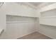 Organized walk-in closet with ample shelving and hanging space, providing efficient storage and convenience at 14177 W Calle Lejos --, Surprise, AZ 85387