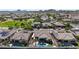 This bird's eye view highlights a desert community with meticulously landscaped homes at 14725 S 182Nd Dr, Goodyear, AZ 85338