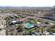 This aerial view features a community center with resort-style pool, solar panels, and desert landscaping at 14725 S 182Nd Dr, Goodyear, AZ 85338