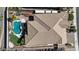 This aerial view showcases a private backyard oasis with a sparkling pool and a luxurious hot tub at 14725 S 182Nd Dr, Goodyear, AZ 85338