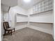 Organized walk-in closet featuring shelving, racks, and space for clothes, shoes and personal items at 14725 S 182Nd Dr, Goodyear, AZ 85338
