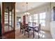 Beautiful dining room with a large table, stylish chairs, and a decorative china cabinet at 14725 S 182Nd Dr, Goodyear, AZ 85338