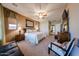 Spacious main bedroom with carpet flooring, ceiling fan, and ensuite bathroom at 14725 S 182Nd Dr, Goodyear, AZ 85338