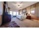 Spacious main bedroom with carpet flooring, ceiling fan, and natural light at 14725 S 182Nd Dr, Goodyear, AZ 85338