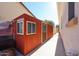 Exterior view of backyard outbuilding featuring office space and additional storage with 