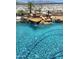 Backyard pool featuring a rock waterfall, desert landscaping, and a fenced perimeter at 14725 S 182Nd Dr, Goodyear, AZ 85338