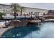 Custom pool area features a miniature train track with a rock waterfall feature at 14725 S 182Nd Dr, Goodyear, AZ 85338