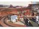 Intricate miniature railroad featuring a detailed town and rail yard with desert backdrop at 14725 S 182Nd Dr, Goodyear, AZ 85338