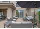 Comfortable back patio with ample seating, covered area, and flowering plants for outdoor enjoyment at 15240 N Clubgate Dr # 168, Scottsdale, AZ 85254