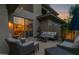 Outdoor patio with comfortable seating, access to interior dining room, and ambient lighting at 15240 N Clubgate Dr # 168, Scottsdale, AZ 85254