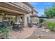 Inviting outdoor patio area with comfortable seating, dining table, and landscaped surroundings at 15240 N Clubgate Dr # 168, Scottsdale, AZ 85254