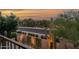 Balcony view with a desert landscape, cactus, and outdoor lighting during a colorful sunset at 15240 N Clubgate Dr # 168, Scottsdale, AZ 85254