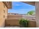 Balcony view of the neighborhood with desert landscaping and a lush potted plant in foreground at 15240 N Clubgate Dr # 168, Scottsdale, AZ 85254