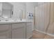 Well-lit bathroom with a shower featuring a curtain, vanity with drawers, and tiled floor at 15240 N Clubgate Dr # 168, Scottsdale, AZ 85254
