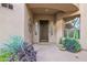 Inviting front porch with decorative plants and stylish front door at 15240 N Clubgate Dr # 168, Scottsdale, AZ 85254