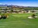 A green community golf course with lush grass and views of the surrounding neighborhood at 15240 N Clubgate Dr # 168, Scottsdale, AZ 85254