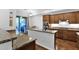 Kitchen with granite counters and an island that looks out onto a back patio with outdoor seating at 15240 N Clubgate Dr # 168, Scottsdale, AZ 85254