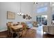 Open-concept living and dining area with high ceilings, hardwood floors, and modern decor at 15240 N Clubgate Dr # 168, Scottsdale, AZ 85254