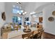 Spacious living area with hardwood floors, high ceilings, open to the kitchen with a fireplace at 15240 N Clubgate Dr # 168, Scottsdale, AZ 85254