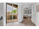 Main bedroom with an exterior balcony, shuttered windows, and carpeted floors at 15240 N Clubgate Dr # 168, Scottsdale, AZ 85254