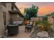 Relaxing outdoor patio with comfortable seating area surrounded by mature landscaping at 15240 N Clubgate Dr # 168, Scottsdale, AZ 85254