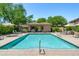 Sparkling community pool with cabana and lounge chairs, perfect for relaxing and enjoying the sun at 15240 N Clubgate Dr # 168, Scottsdale, AZ 85254