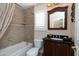 Well-maintained bathroom with a tub-shower combo and dark wood vanity at 15550 N Frank Lloyd Wright N Blvd # 1040, Scottsdale, AZ 85260