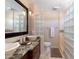 Bathroom featuring dual sinks with granite countertops and glass block shower at 15550 N Frank Lloyd Wright N Blvd # 1040, Scottsdale, AZ 85260