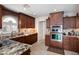 Elegant kitchen featuring stainless steel appliances, granite countertops, and stylish cabinetry at 15550 N Frank Lloyd Wright N Blvd # 1040, Scottsdale, AZ 85260
