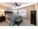 Comfortable main bedroom featuring a ceiling fan and decorative window for ample natural light at 15550 N Frank Lloyd Wright N Blvd # 1040, Scottsdale, AZ 85260