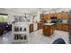 Open kitchen with breakfast bar, island, stainless appliances, and an abundance of cabinet storage at 16974 W Marcos De Niza Dr, Surprise, AZ 85387