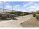 Walking path lined with desert landscaping, offering a peaceful outdoor experience at 16974 W Marcos De Niza Dr, Surprise, AZ 85387