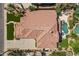 Stunning aerial view of tile roof, pristine pool, and lush landscaping in this beautiful desert home at 1808 S Sailors Way, Gilbert, AZ 85295