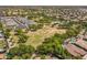 Picturesque aerial view showcasing the community with lush greenery, mature trees and green spaces at 1808 S Sailors Way, Gilbert, AZ 85295